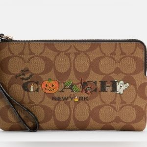 Brand New Halloween Edition Coach large Wristlet! 🎃👻 it’s a must have! Limited